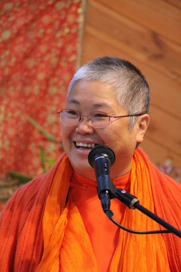 Swami Sitaramananda at the Sivananda Yoga Farm smiling and teaching