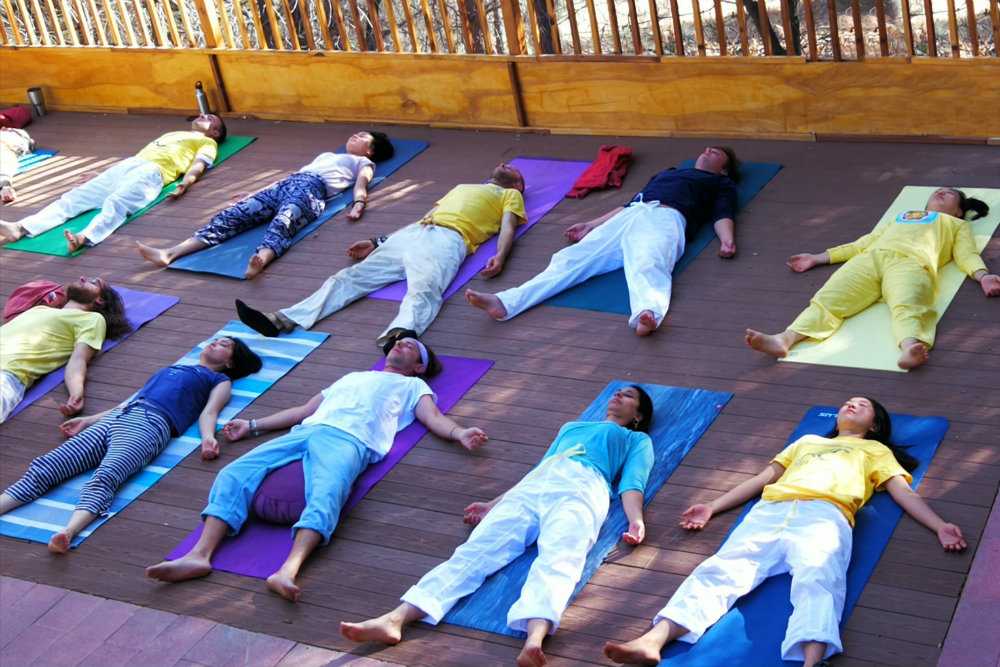 group lying savasana corpse pose