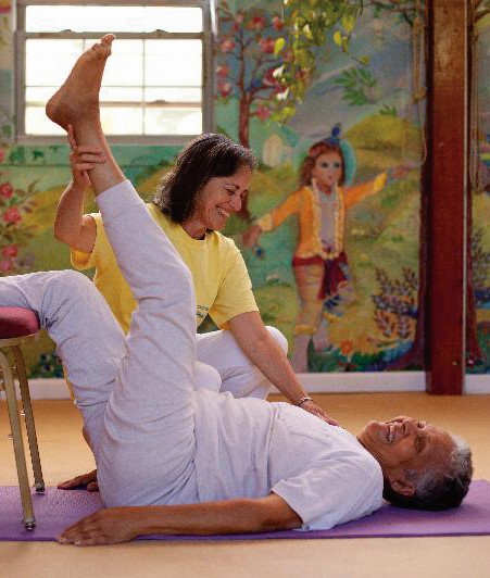 Teaching gentle yoga outside in the grass